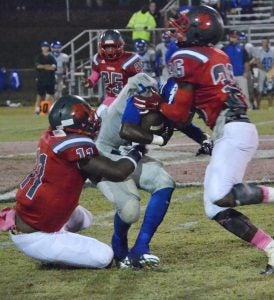 North Panola players Malcomn Lyons (left) and Kylan Osborn (right) take down a Water Valley player. North Panola trampled Water Valley 32-7 last Friday during homecoming.  The Panolian Photo by Ike House