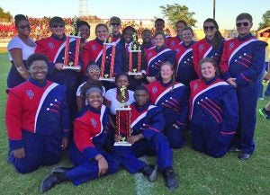 The South Panola band traveled to Grenada to be evaluated in the MHSAA Region II Marching Band Evaluation. Ratings from I to IV are given at evaluation. The drum major, color guard, percussion, and band each earned superior (I) ratings. Senior band members displaying the trophies the band received include (first row, l. to r.) Seated from left to right: Torrince Lee, Mia Bass, Nyaisha Doyle, Briyona Little, Robert Mosley, Brittany Boyles, Aubrey Britt; (back) Camille Ivy, Tyler Allen, Ce’Kedria Griffin, Carly Coleman, Alex Lambert, Destiny Lamar (drum major), Shaniqua Miles, Anna McCrite, Quen Gaston, Aerial Sanford, Kimberly Cook, Emily Houston and Zac McCrite. Photo by Laura Bryant, SP assistant band director