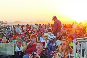 Luke Bryan fans, estimated at 5,000 by Panola County Emergency Management Director Daniel Cole, gathered at sunset to await the country star’s concert at John Thomas’ farm in the Macedonia Community. Wednesday night. See story on A2. The Panolian photo by Glennie Pou