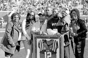 Three Ole Miss seniors including Tony Conner was honored during senior ceremonies Saturday at the Egg Bowl. With him are family members (from left) sister-in-law ChaQuita Conner, girlfriend Chasity Baker, father David Conner Sr., Tony, brother David Conner with David’s daughter Ma’Kenzly and mother Mary Ann. The Panolian Photo by Andy Young