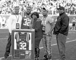 Honored at Saturday’s Egg Bowl was Ole Miss senior Temario Strong of Batesville with family members (left to right) Javon Norris (brother), Temario, Lisa Strong (mother), Ladarius Strong (brother) and Eric Conner uncle. The Panolian Photo by Andy Young