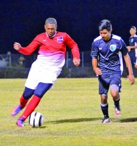 South Panola’s Cortez Campbell (left) brings the ball down the field in a recent match. South Panola boys defeated Columbus in district action Friday 3-0. The soccer teams will be at Hernando today for a district match at 5 and 7 p.m. Friday, South Panola will host Tupelo in district at 5 and 7 p.m. Photo by Jeff Eubanks, SP School District