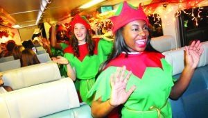 Elves entertain passengers on the Polar Express on its way back to Batesville from the North Pole.
