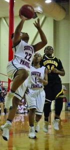 South Panola’s Breanna Bland goes for the layup while teammate Marshala Doyle backs her up. The Panolian photo by Ike House