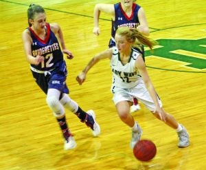 Ally Alford takes a Kirk defender to the basketball on Thursday night. Alford finished with 14 points.  The Panolian photo by Will Dickins