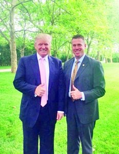 Candidate Trump posed with his Secret Service Agent, Patrick Davis, during last summer’s campaign. Photo provided
