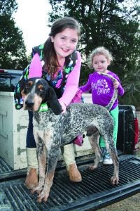 Coon hunting gals Presley Gammel, 9, and Baylor Gammel, 4, will be rooting for Joe, an English coonhound owned by Britton Crawford, at this weekend’s UKC Winter Classic.  The Panolian photo by Rita Howell