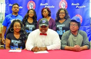 After a long recruiting season, South Panola’s O’Bryan Goodson (front, center) signed a National Letter of Intent to play for the University of Memphi. Family and friends in attendance Wednesday were (front) parents Cherry Strong and Darrell Goodson; (back) brother Shawntabis Fletcher, sister Emerald Strong, girlfriend Briyona Little amd sister Kiera Strong. Photo by Jeff Eubanks, SP School District